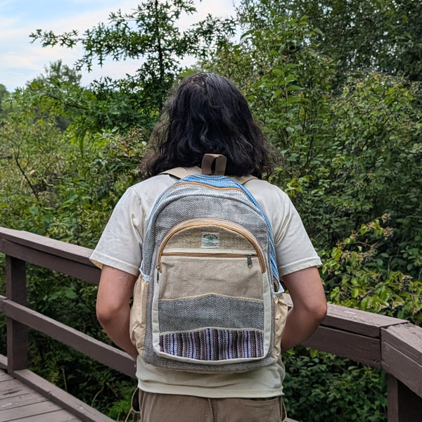 Person wearing a hemp bag in a forest setting