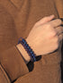 A Man Wearing Amethyst Bracelet And Lapis Lazuli Bracelet