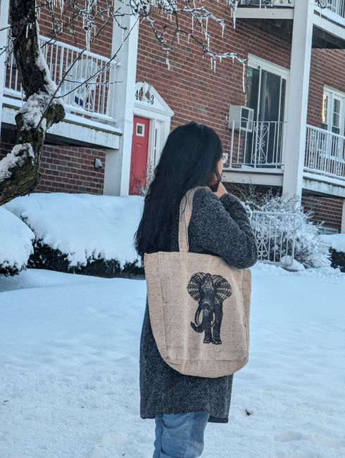 a woman carrying a tote bag