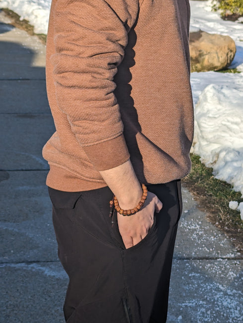 A Man Wearing Rudraskya Buddhist Bracelet